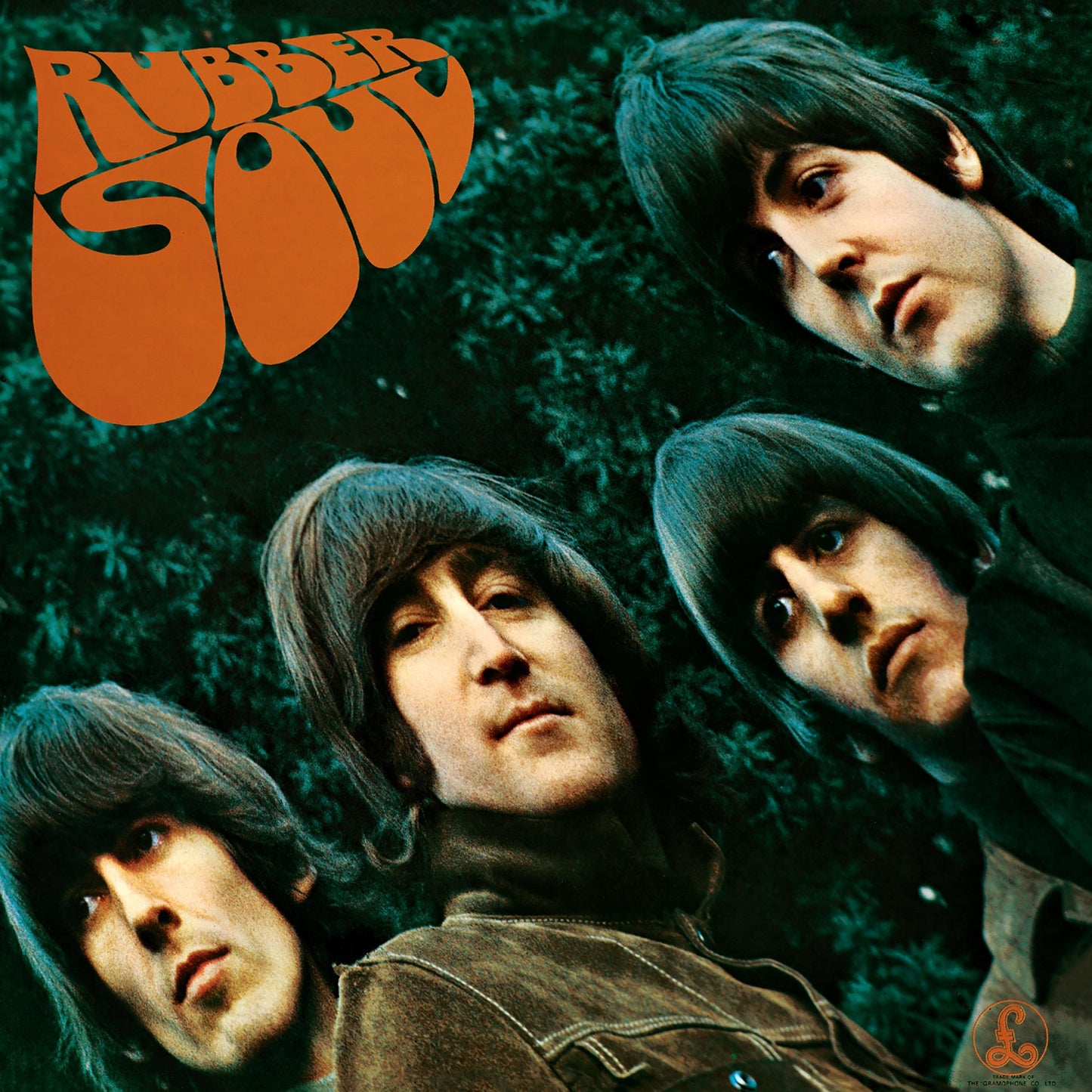 Vinyl album cover art with four band members in dark tones.