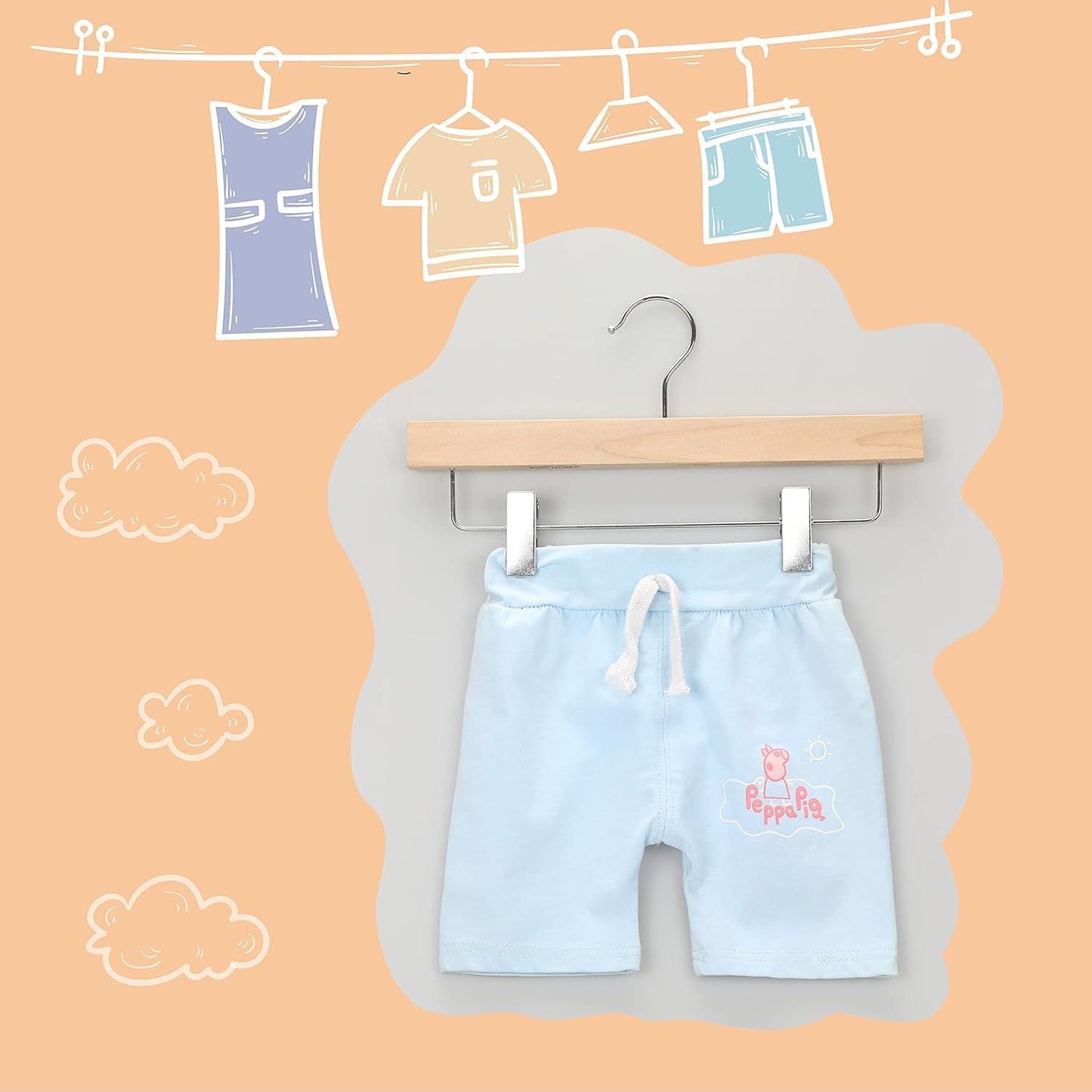 Wooden clip hanger with chrome hook holding light blue Peppa Pig-style shorts
