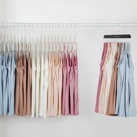 Multi-hook bra and tank top hangers with pastel tank tops and bras on a closet bar