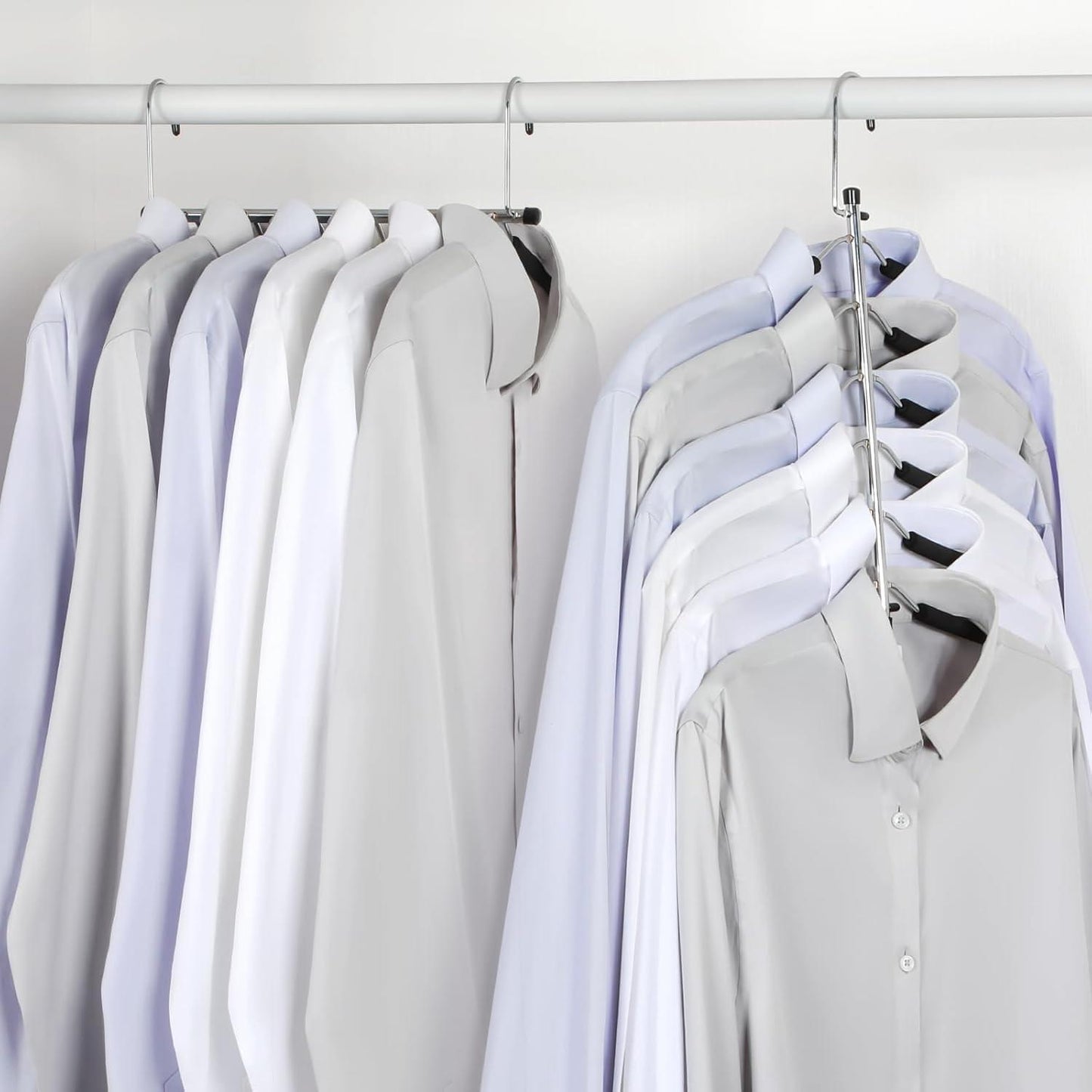 Set of multi-tier shirt hangers on closet rod, holding light-colored shirts