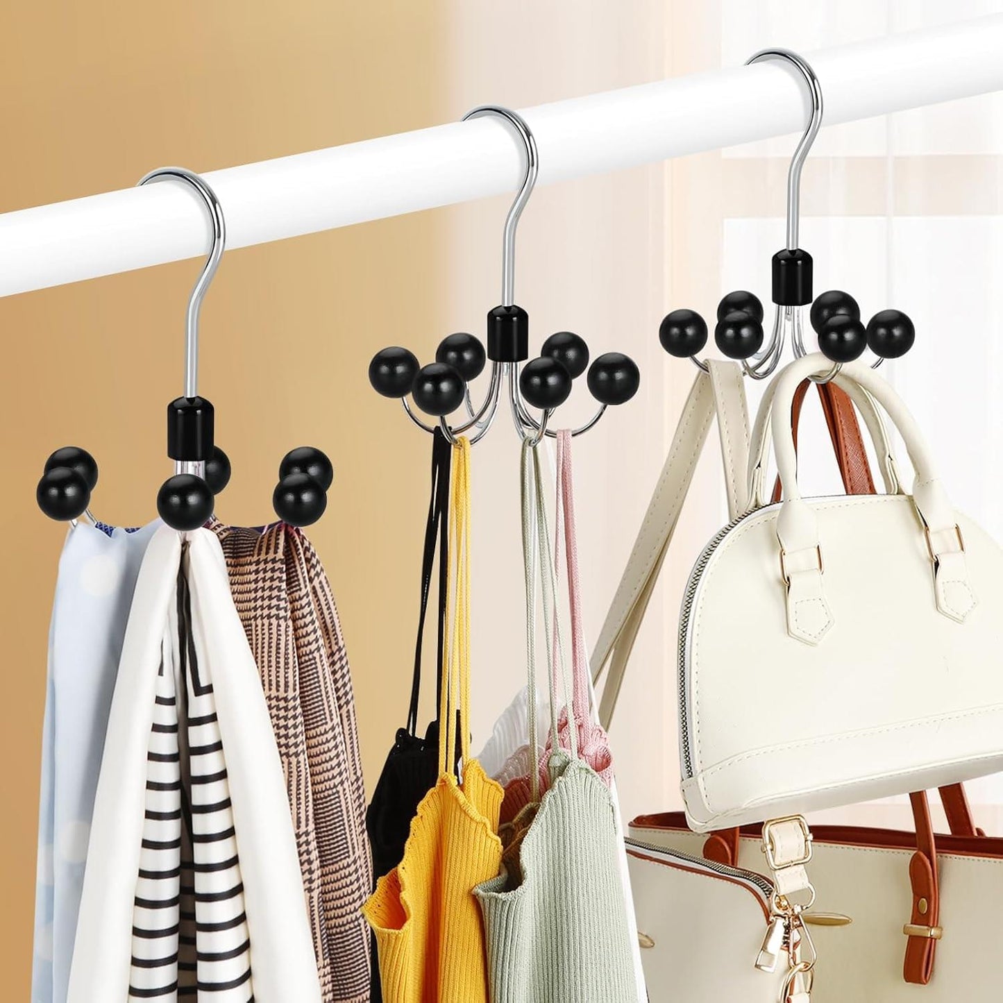 Accessory organizer with black ball hooks holding scarves and a handbag