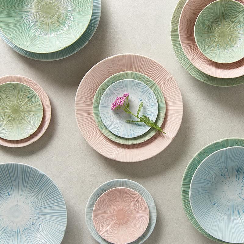 Tapas plates with pastel glazes, including an ice green round plate