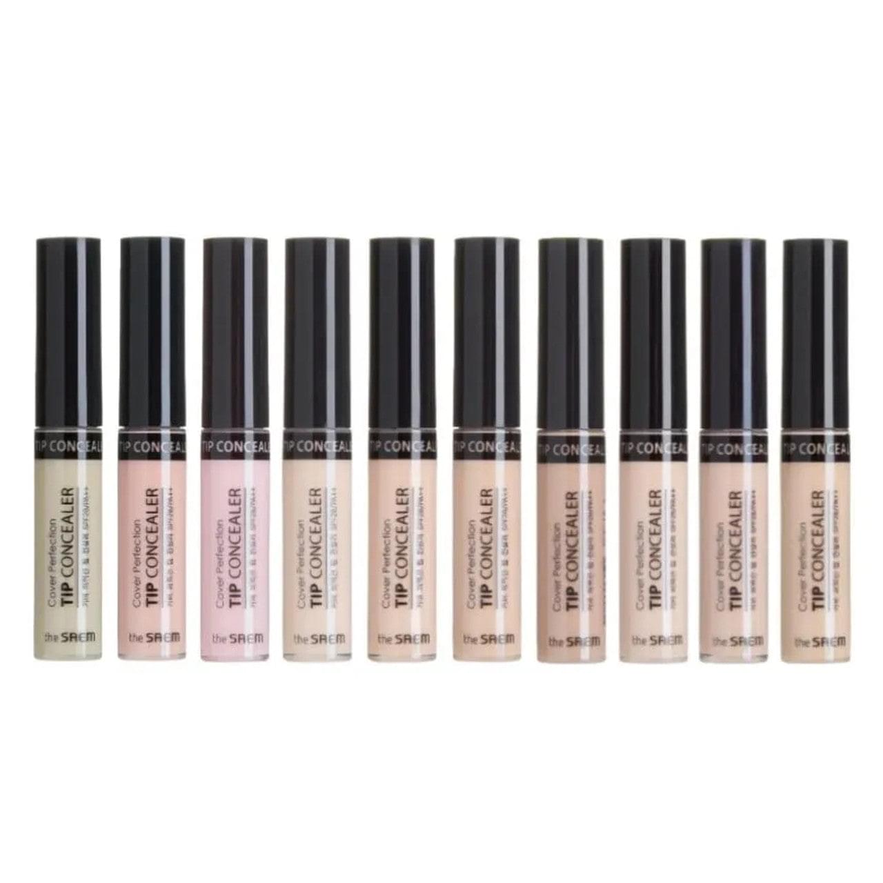 Line of tip concealer tubes in multiple beige shades with dark caps.