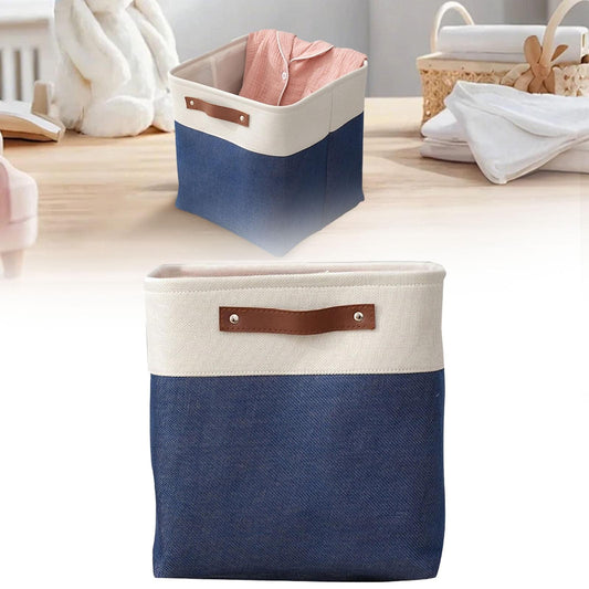 Two-tone fabric storage bag with brown handle, navy lower half and cream upper half