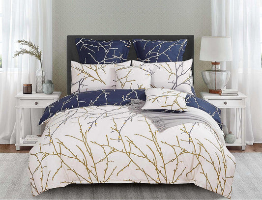 Reversible duvet cover set showing cream side with gold tree branches and navy reverse