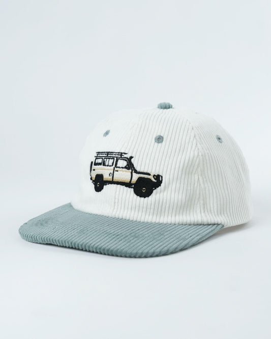 White ribbed cap with teal underbrim and embroidered van graphic on front