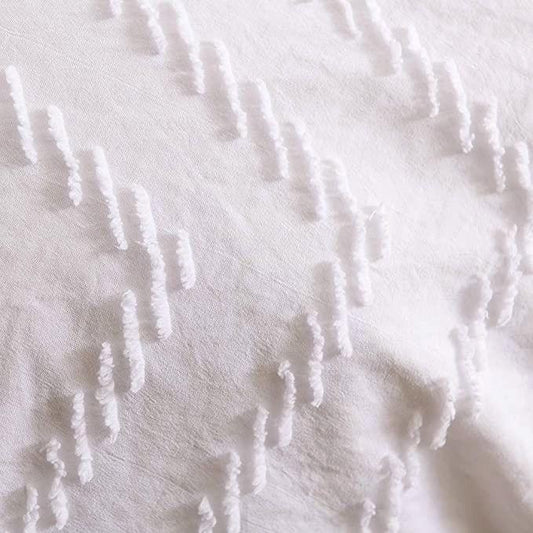 White wave jacquard duvet cover fabric close-up with textured tufted ridges