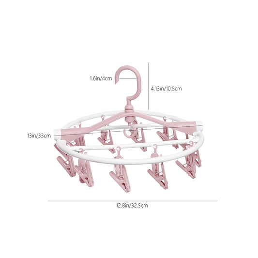 Pink clip clothes drying rack with white round frame and hanging clips