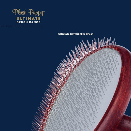 Soft slicker brush head with fine pins and maroon cushion back; wood handle