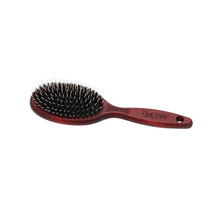 Oval porcupine hair brush with black bristles and reddish-brown handle