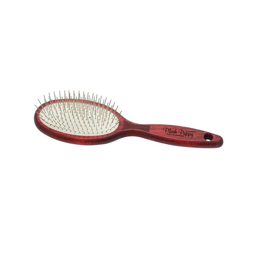 Oval pin brush with red-brown handle, metal pins set in cushioned pad