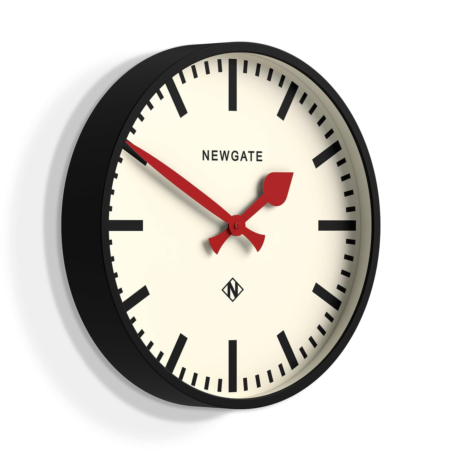 Black round wall clock with cream railway dial and red hands, NEWGATE branding