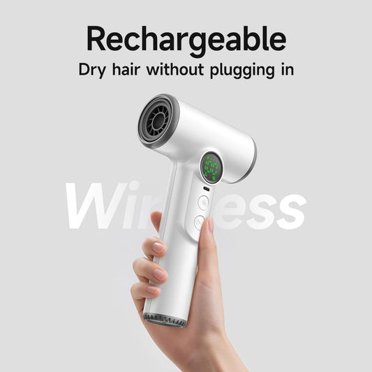 White cordless hair dryer with green screen and control buttons in hand