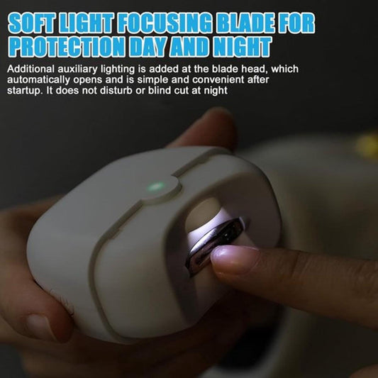 Handheld white electric nail clipper with built-in light near a finger