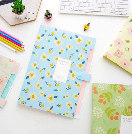 Floral document folder with light blue cover, pink inner panels, and label card pocket