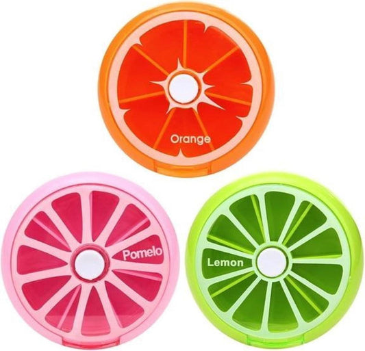 Fruit-themed round pill boxes: orange, pink, and green citrus-slice lids