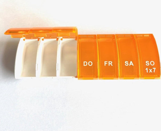 Orange 7-day pill box open with white base and DO–SO compartment lids