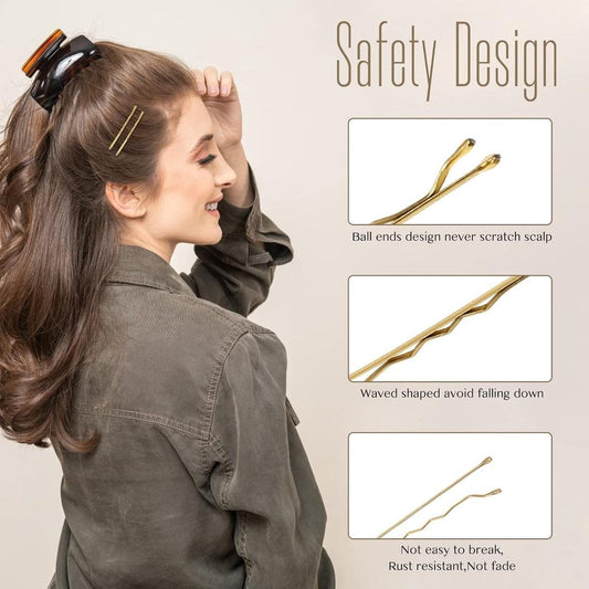 Gold hairpins holding a half-up hairstyle on a woman