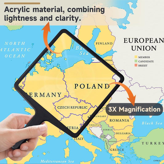 Handheld 3x magnifying glass held over a map