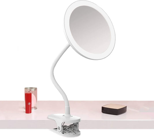 Clip-on magnifying makeup mirror with LED ring and base, angled tabletop view