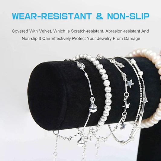 Black velvet bracelet stand with multiple necklaces and bracelets on display