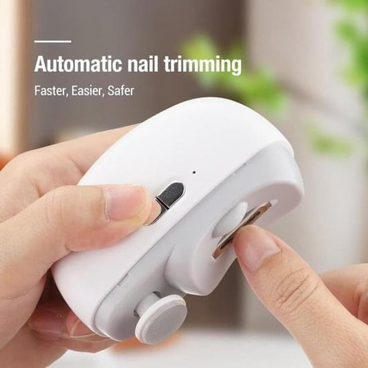 Electric nail clipper in hand with automatic nail trimming slot