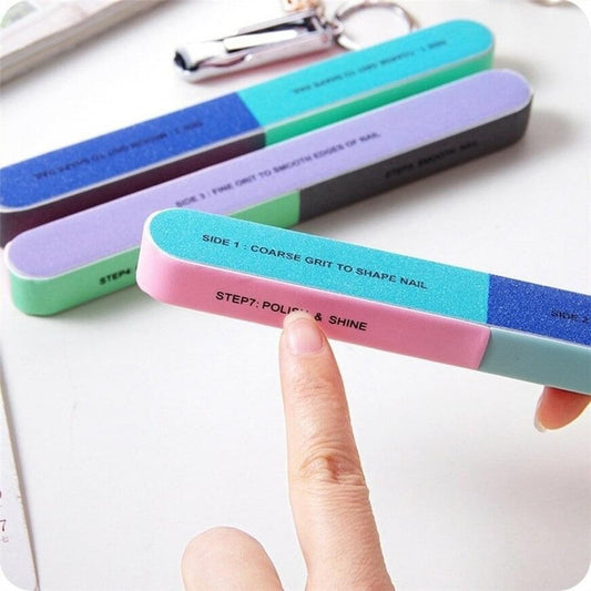7-way nail file and buffer bars in blue, teal, purple, and pink with step labels