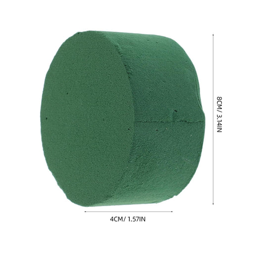 Green foam block, rounded cylinder shape, about 4cm wide