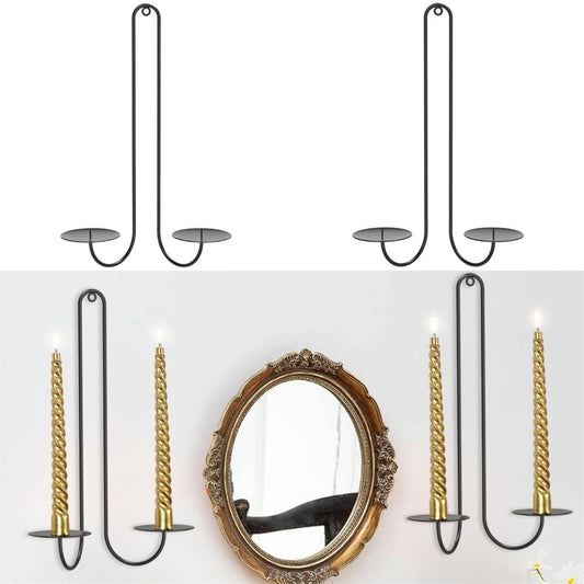 Black wall-mounted candle sconces with two U-shaped holders and round plate bases