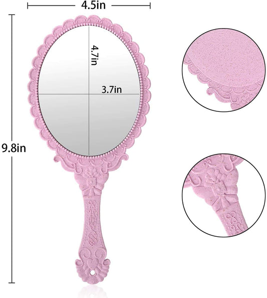 Pink compact handheld mirror with textured embossed back and scalloped border