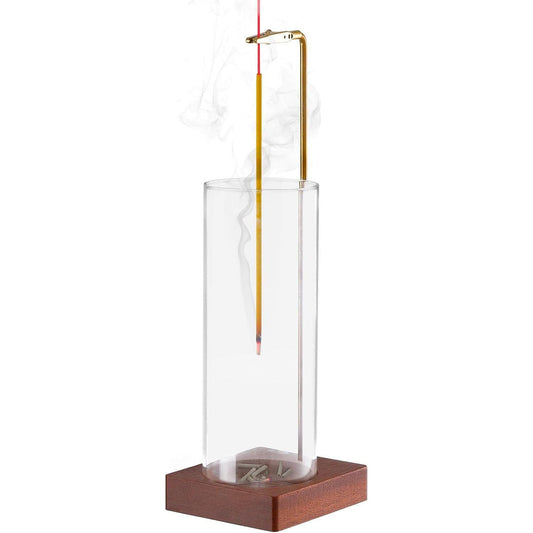 Clear glass incense stick holder with brass frame and dark wood base