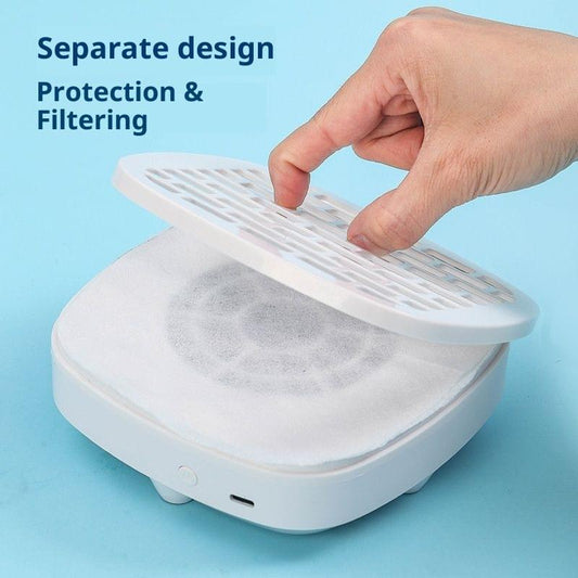 White nail dust collector base with removable top cover held by hand.