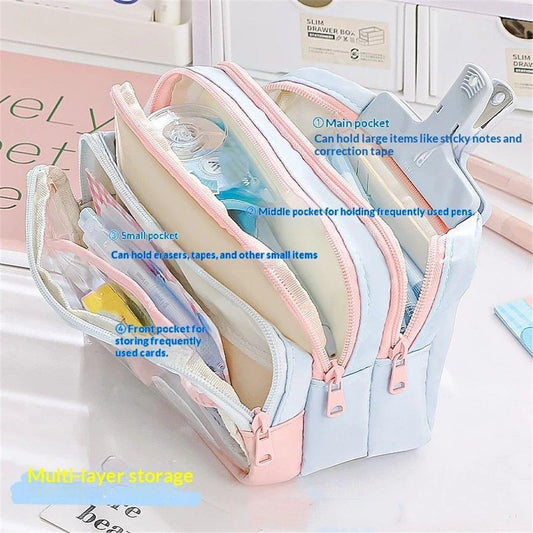 Transparent 4-layer pencil case with multiple compartments and zip openings, pink and blue