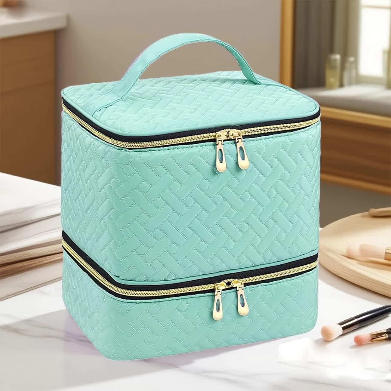 Nail tool carry-on bag with quilted teal double-zip compartments and top handle