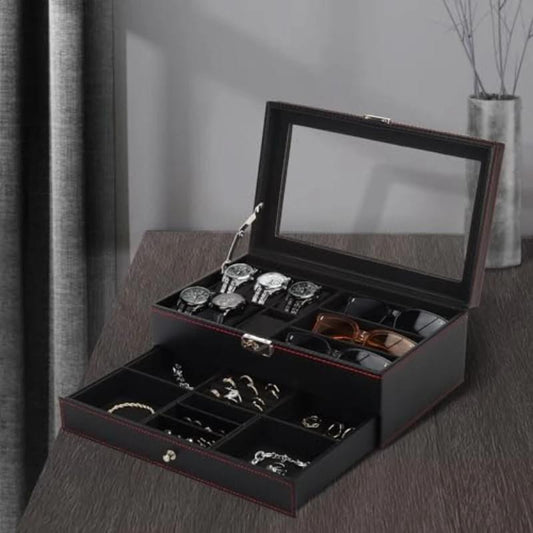 Open black watch and glasses storage box with watch slots and accessory tray