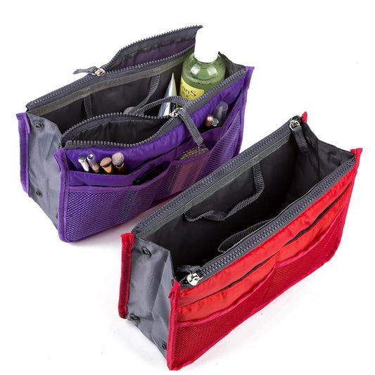 Purple and red toiletry insert organizer bags, open with zip compartments