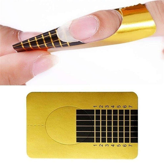 Gold nail form strip being applied over natural nail with grid pattern