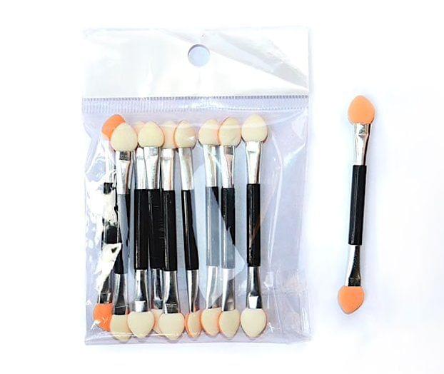 Makeup sponge applicators set in clear pouch, black handles with peach and white tips