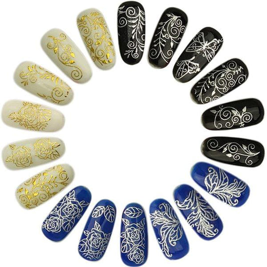 Nail sticker set with gold swirls on light nails and white linework on black tips