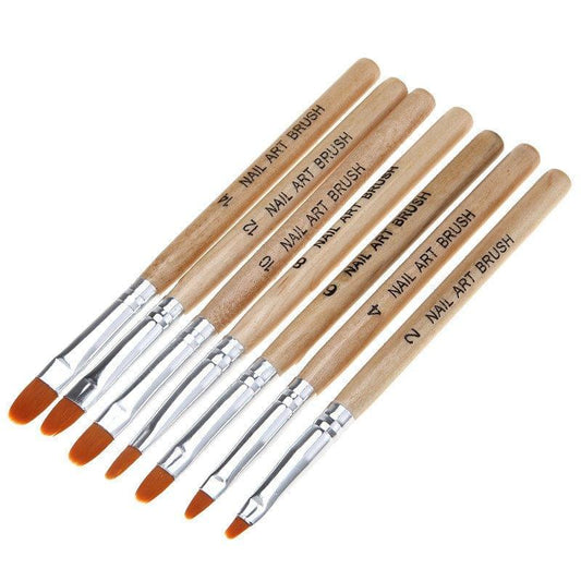 Seven nail art brushes with wooden handles and silver ferrules, orange bristles shown.