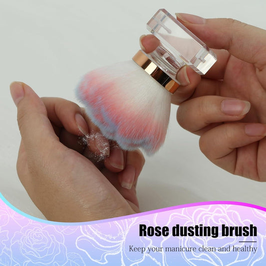 Pink rose nail dust brush with full bristles, clear base, and gold ring accents
