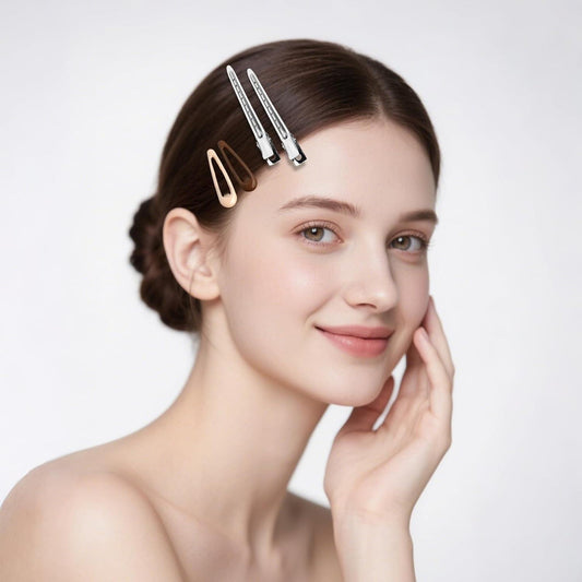 Small silver snap hair clips holding hair sections