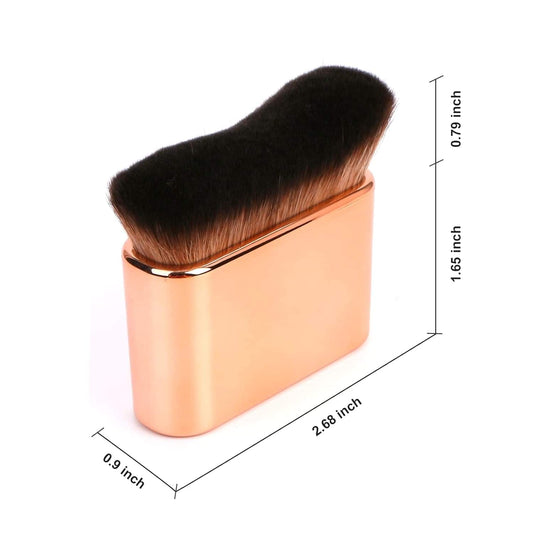 Rose gold self-tanning brush with thick black bristles, shown with size markings