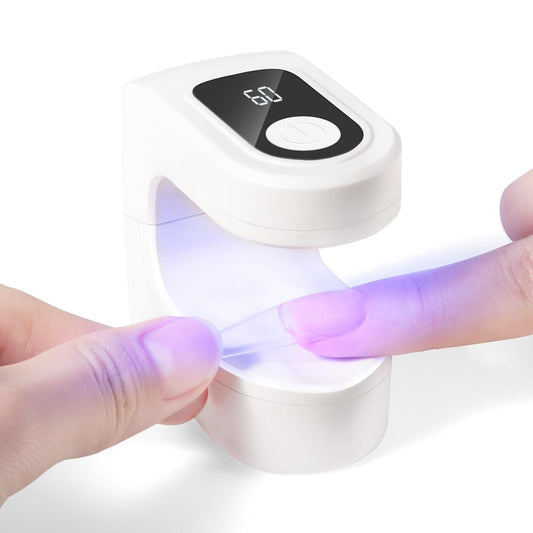 White LED UV nail lamp with glowing curing light and timer display, open hood
