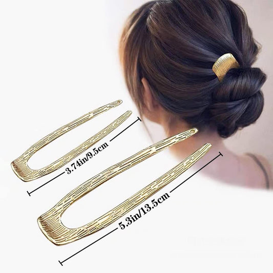 Gold U-shaped hair pins with elongated open fork prongs for updos