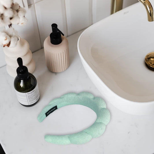 Mint and cream puffy sponge spa headbands with curved plush loops for face washing