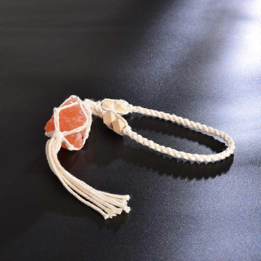 Hanging macrame ornament with orange stone cube charm and tan bead spacer