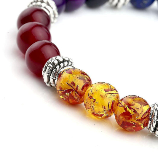 Beaded bracelet with red round stones, yellow speckled beads, and silver-tone spacer beads