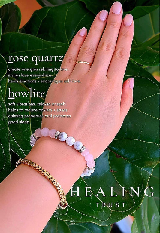 Crystal bead bracelet on wrist with pink and light stones, silver-tone spacers