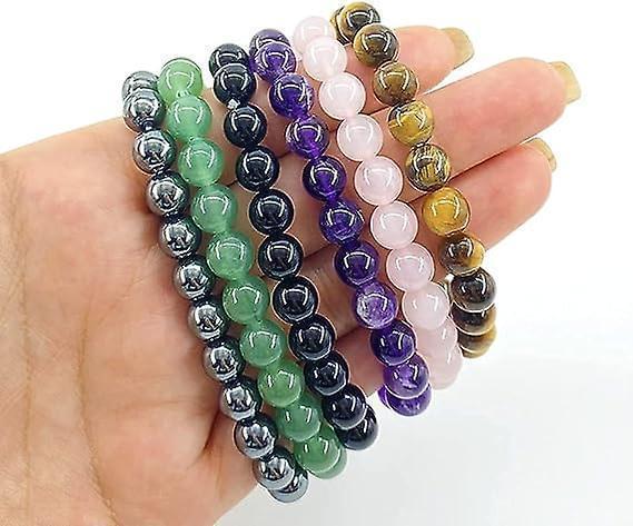 Beaded stretch bracelet set in mixed green, black, purple, and pink beads